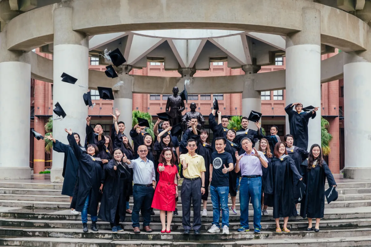 International students posing together on the NSYSU campus