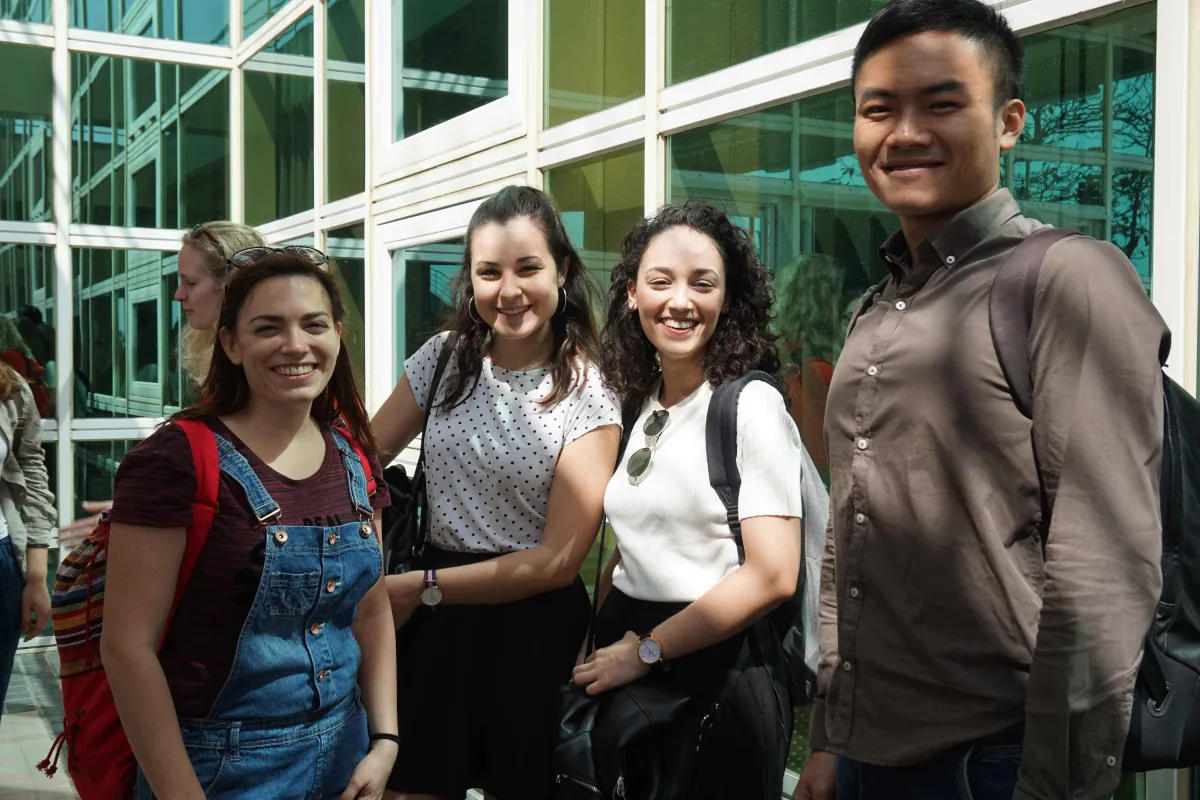 Visiting students posing together on campus